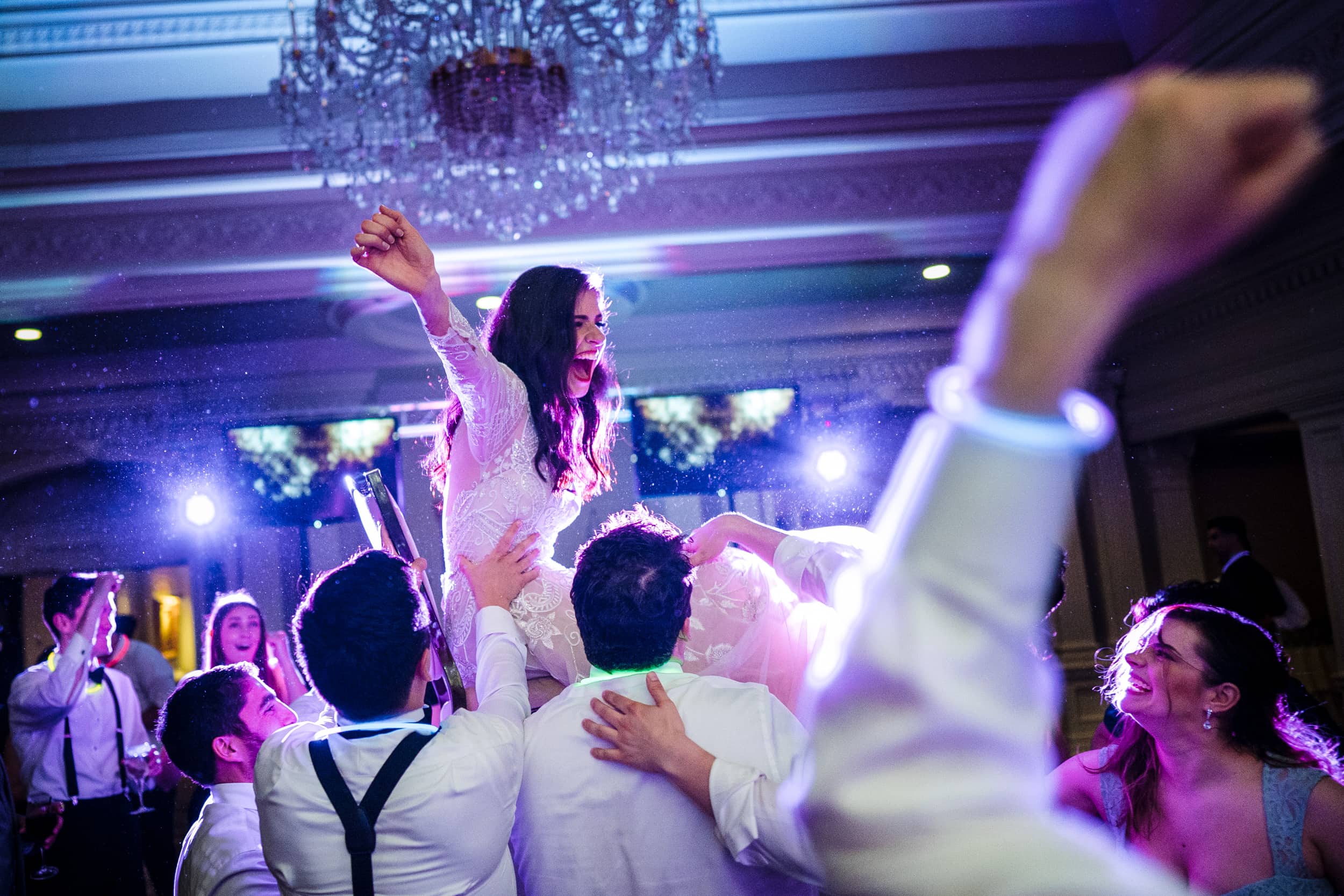 Phoenix Wedding Photography by JD Land of a bride crowd surfing and partying it up at her reception